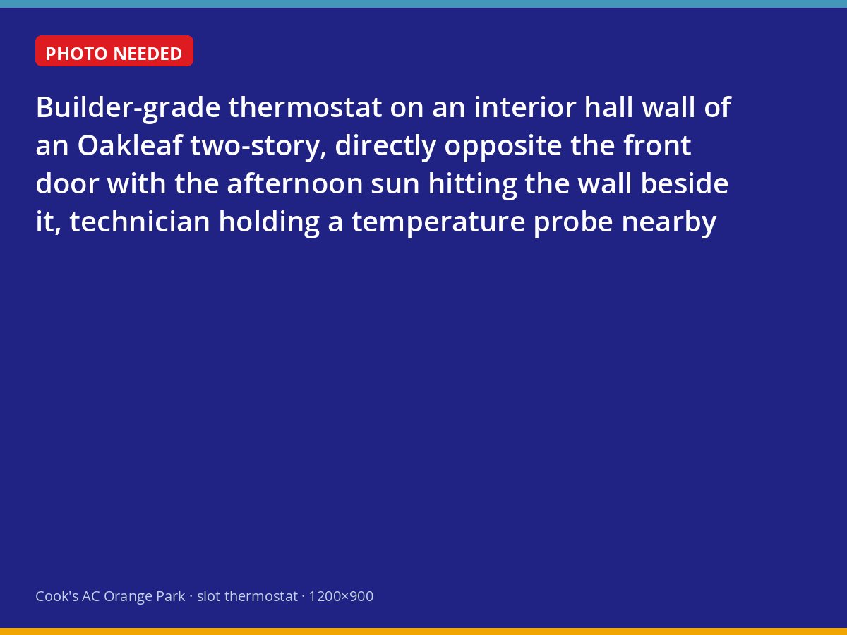 Original thermostat on a sunlit hallway wall in an Oakleaf Plantation home