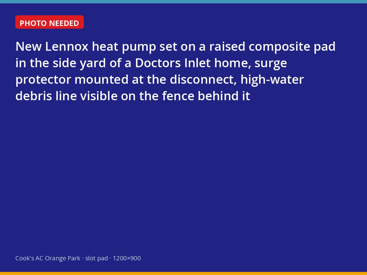 Heat pump on a raised pad with a surge protector at a Doctors Inlet home