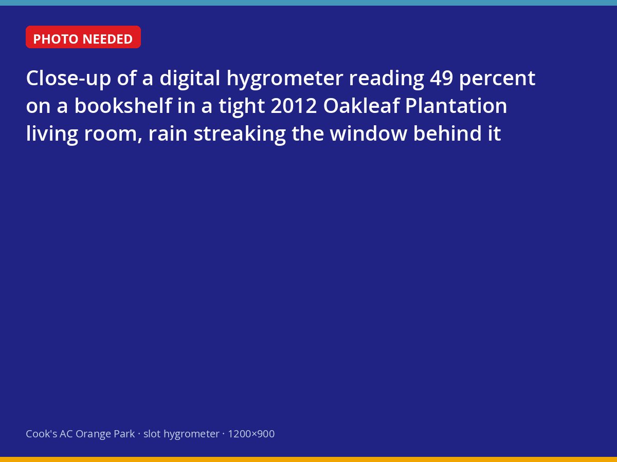 Hygrometer reading 49 percent humidity in an Oakleaf Plantation living room during rain