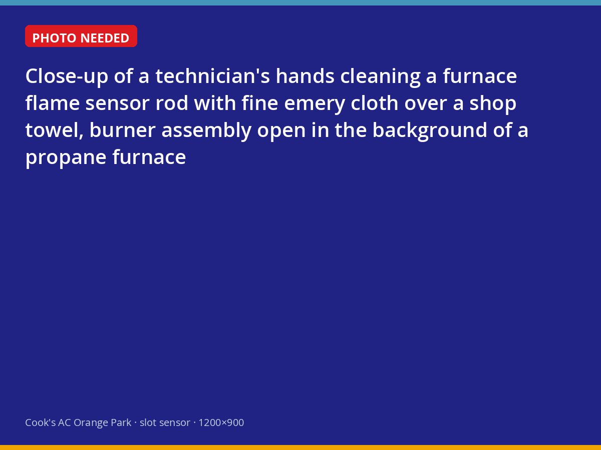 Technician cleaning a furnace flame sensor